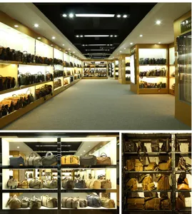 Detailed showroom display and close-up views of vintage canvas and leather travel duffel bags.