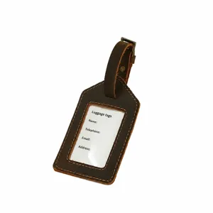 Genuine leather luggage tag detail close-up, retro brown cowhide travel label holder
