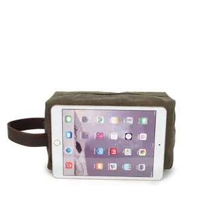 Men's vintage canvas toiletry bag, casual wash bag and leather wrist clutch for travel.
