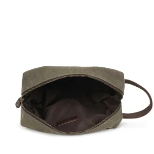Men's vintage canvas toiletry bag travel dopp kit with leather strap main view.
