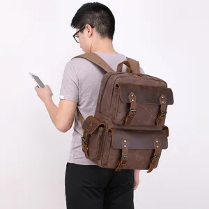 Men's vintage canvas leather backpack, large capacity waterproof travel computer bag main view.