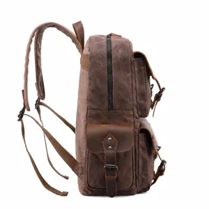 Vintage canvas leather backpack for men, multi-pocket travel rucksack, waterproof.