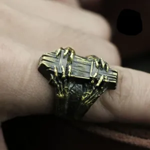 Detailed view of the gothic coffin ring featuring a skeleton claw design in antique metal finish.