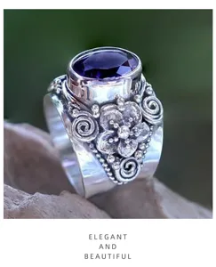Vintage Thai silver purple gemstone ring featuring intricate floral carving and elegant retro design detail.
