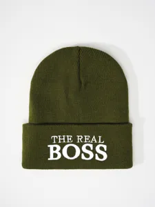 Green knitted beanie hat for winter, warm cuffed cap with white embroidered slogan text letters.