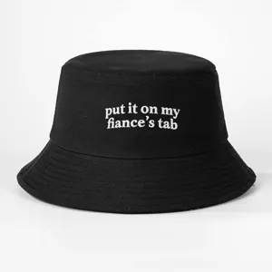 Black cotton bucket hat featuring trendy white embroidered text quote design for casual daily wear.