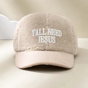 Close-up detail shot of the embroidered shearling and corduroy color-blocked baseball cap.