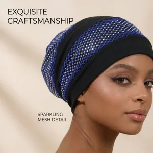 Detailed view of women's black rhinestone turban hat with blue sparkling mesh detail.