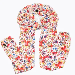 Detail view of floral print long hair wrap bonnet, silky smooth fabric for curly hair care.
