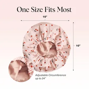 Waterproof shower cap with cherry print and adjustable strap for hair care protection.
