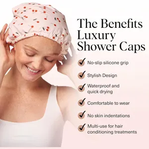 Detail shot of waterproof shower cap with cherry print and comfortable grip for hair care.