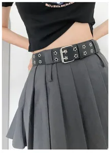 Y2K punk style black double grommet belt with star cutout rivets for alternative fashion looks.