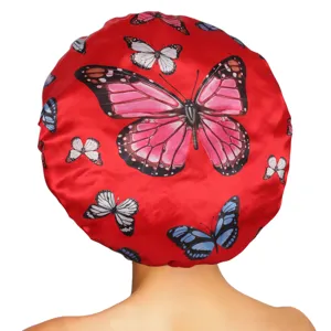 Red satin butterfly print sleep cap with wide elastic band for hair care and beauty routines.