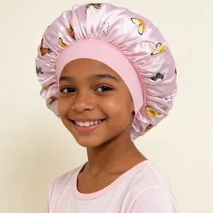 Kids satin sleep bonnet with cute butterfly print and wide elastic brim for hair care.