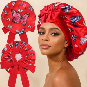 Silk satin hair bonnet with butterfly print and long ties for sleeping care and daily beauty styling.