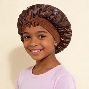 Kids satin sleep bonnet with butterfly print, cute bow design, elastic hair care night cap.