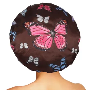 Detailed view of the brown satin sleep cap showing the colorful butterfly print and band.