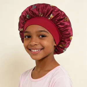 Kids satin sleep bonnet with wide elastic band and cute butterfly print for hair care protection.