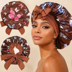 Satin hair bonnet with butterfly print and bow strap, elastic sleep cap for hair care.