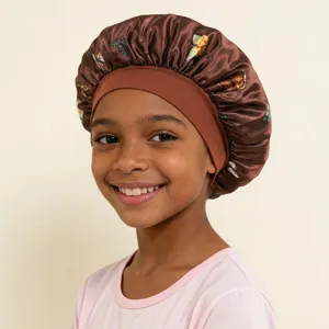 Kids satin sleep bonnet with wide elastic band and beautiful butterfly print for hair care.