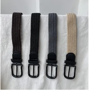 Braided elastic belt detail, casual woven design with black metal pin buckle for use.