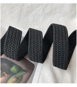 Black woven elastic belt detail shot, premium nylon material with neat braided texture.