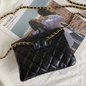 Black quilted leather waist bag with gold chain strap, stylish chic mini fashion belt bag for women.