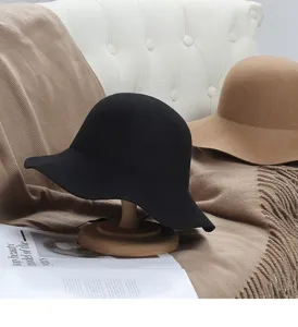 Detailed shot of wool felt bucket hat in cozy setting, wide brim winter fashion accessory.