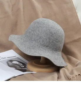 Grey wool felt bucket hat with wavy wide brim, vintage British style for autumn and winter.