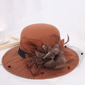 Retro Hepburn style brown wool felt hat detail, featuring elegant mesh veil, flower and feather decor.