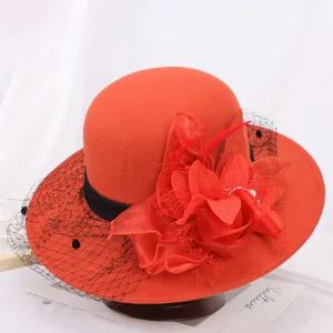 Elegant red wool felt hat with black mesh veil and floral decoration for women winter style.