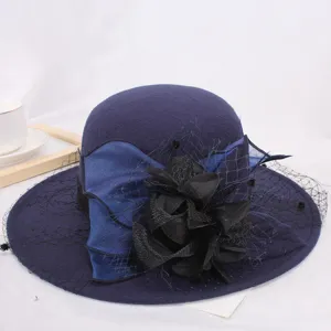 Close-up detail view of the navy wool felt hat highlighting the exquisite black mesh veil and floral decor.