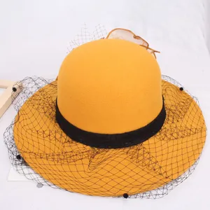 Elegant yellow wool felt hat with black lace and mesh veil for women autumn winter fashion.