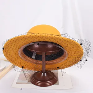 Yellow wool felt bucket hat with black veil elegant vintage women winter hat detail view
