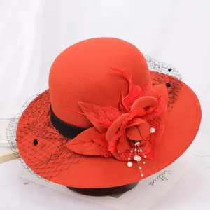 Red wool felt hat for women, vintage Hepburn style bucket hat with mesh veil and floral decor.