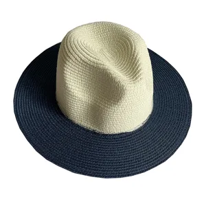 Stylish two-tone straw Panama hat with beige crown and navy brim for summer sun protection.