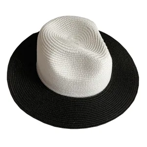 Stylish black and white straw hat for women, ideal for summer beach vacation and daily wear.