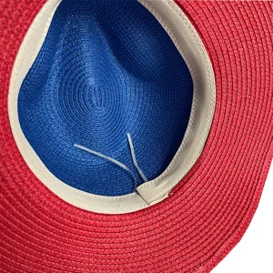 Detailed view of the summer straw hat inside, featuring a blue crown and red brim.