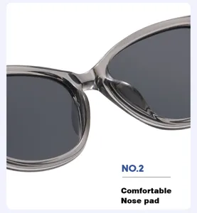 Vista dettagliata occhiali da sole cat-eye alla moda, montatura grigia semitrasparente.