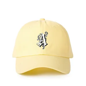 Light yellow cotton baseball cap with stylish gothic letter A print, adjustable outdoor casual cap.