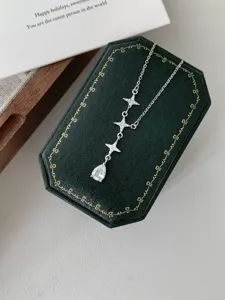 Detailed view of S925 sterling silver star and teardrop pendant necklace with vintage design.