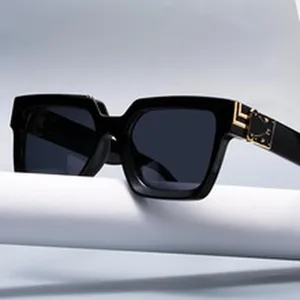 Black square sunglasses for men and women, stylish chunky frame with gold temple decor.
