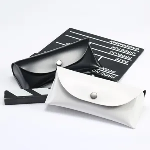 Etui a lunettes portable en cuir noir et blanc avec bouton pression pour rangement de soleil.