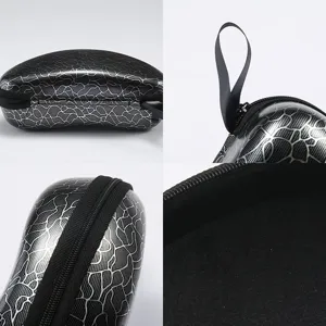 Astuccio per occhiali rigido con chiusura lampo, elegante custodia portaoggetti nera e argento.