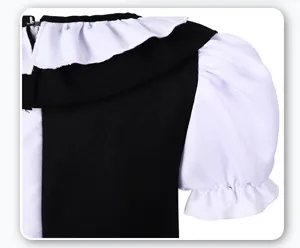 Kids black and white cosplay costume detail with elegant ruffles and puffy sleeves.