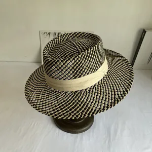Detailed view of the black and beige woven fedora sun hat, stylish summer beach hat.