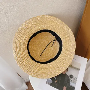 Classic flat top straw hat for women, elegant summer beach sun protection boater hat.