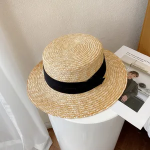 Retro flat top straw hat with black ribbon, classic French style sun protection beach hat for summer.