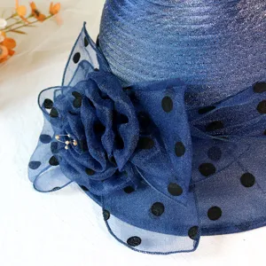 Close-up detail view of women summer sun hat organza mesh flower polka dot breathable.