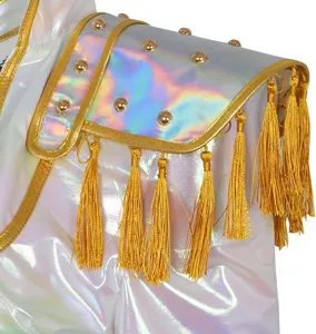 Close-up of kids K-POP cosplay costume shoulder with holographic white fabric, gold studs, and tassels.